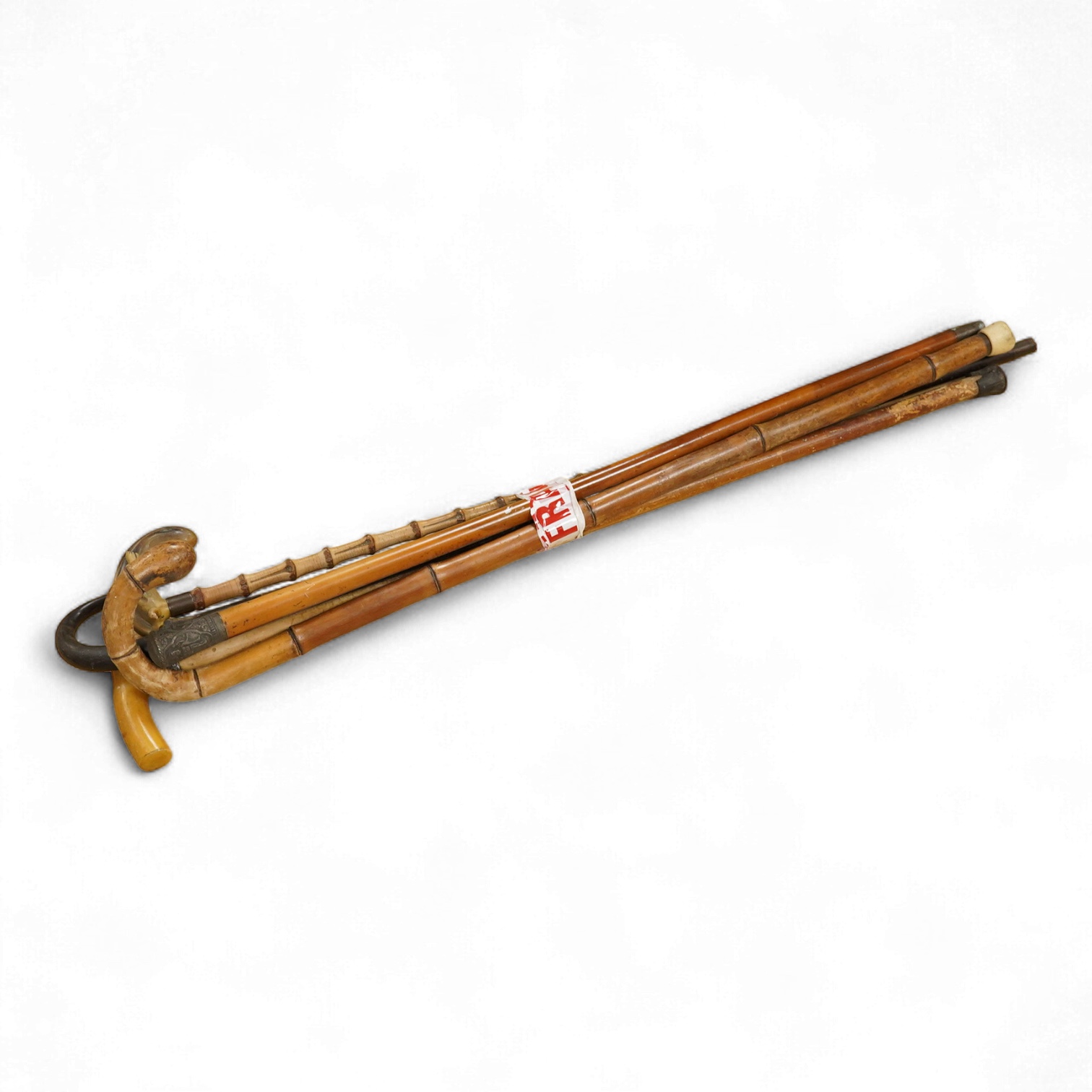 A collection of six various walking canes to include a silver mounted example and one with horn handle